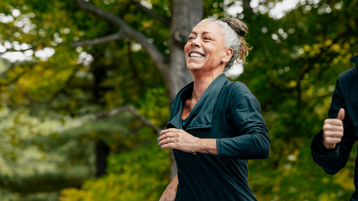 happy mature woman jogging
