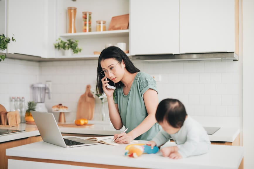 woman-remote-working-with-baby-mom-guilt